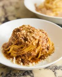 Sorelle signature dishes Cacio e Pepe, Prosciutto San Daniele, Agnello (Lamb Loin), various house-made pastas and wood-fired pizzas.